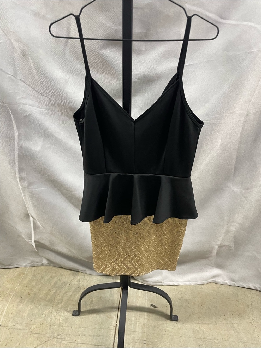 Necessary Clothing Black Peplum Top with Gold Zigzag Skirt Accent